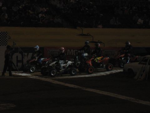 1994 Ford Bronco - Four-wheelers are lined up at the starting line, ready for a race, with a checkered flag visible.