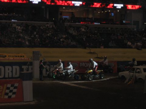 1994 Ford Bronco - Four-wheelers prepare for a race event with a crowd watching from the stands.