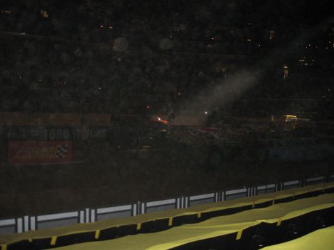 1994 Ford Bronco - A monster truck is seen in an arena with a "Ford Trucks" banner in the background.