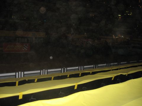 1994 Ford Bronco - Monster truck event at an arena with Ford Trucks signage visible.