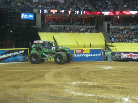 1994 Ford Bronco - The iconic Grave Digger monster truck is seen on the arena floor, ready for action.