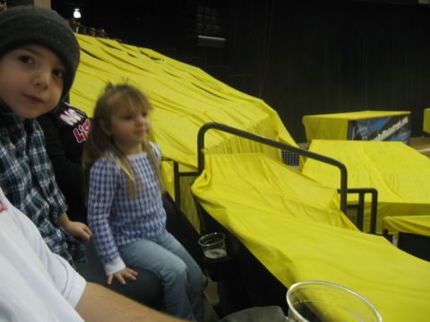 1994 Ford Bronco - Children watch an event from stadium seating covered in yellow tarps.