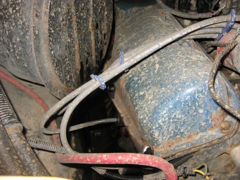 1979 Ford Bronco - Engine valve cover with spark plug wires and visible rust detail.