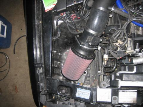 1996 Ford Thunderbird - Aftermarket air intake system installed in the engine bay.