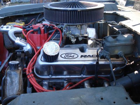1971 Ford Bronco - The engine bay shows a Ford V8 with a prominent air filter and custom valve covers.
