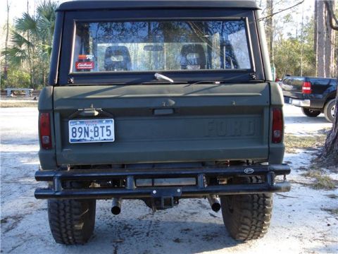 1971 Ford Bronco - Rear view of a 1971 Ford Bronco, a custom bumper and off-road tires.