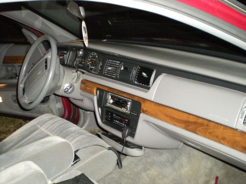 1994 Ford Crown Victoria - Interior view of a 1994 Ford Crown Victoria, showing the dashboard, steering wheel, and front seats.