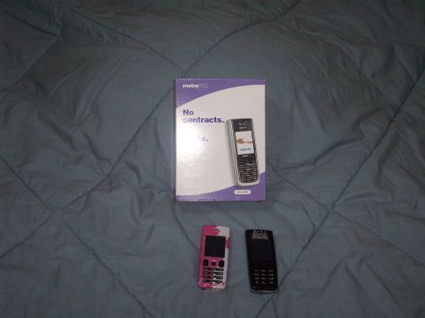 2006 Ford F-150 - Three cell phones are displayed with a MetroPCS box that advertises 'No contracts.'