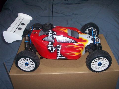 2006 Ford F-150 - A remote control buggy with a flame graphic design sits on a cardboard box.