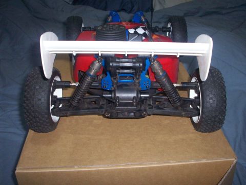 2006 Ford F-150 - Remote control car's rear suspension and spoiler are visible in this close-up shot.