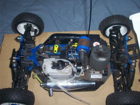2006 Ford F-150 - Close-up view of the engine and chassis of a remote-controlled car, showing its mechanical components.