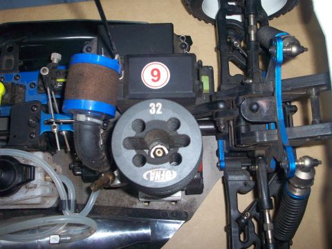 2006 Ford F-150 - Detail shot of a remote control car's engine, a prominent flywheel and air intake system.