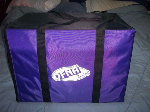 2006 Ford F-150 - A purple bag with a racing logo is shown on a bed.