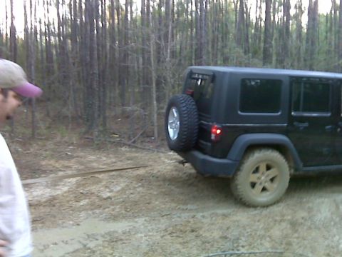 2008 Jeep Wrangler - Black 2008 Jeep Wrangler on a dirt road in a wooded area.
