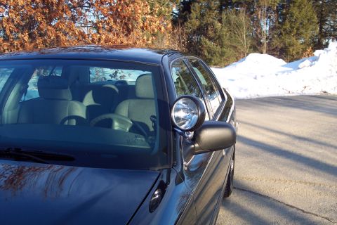 2001 Ford Crown Victoria - This 2001 Ford Crown Victoria Police Interceptor is parked on a road with snowbanks visible in the background.