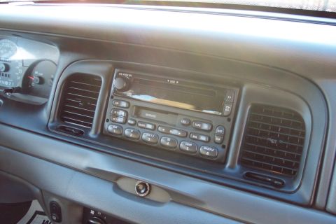 2001 Ford Crown Victoria - Interior view of a 2001 Ford Crown Victoria dashboard, showing the radio and air vents.
