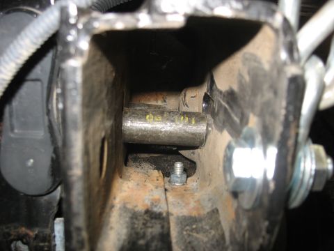 1995 Ford C-350 (Centurion Conversions) - Detail of a vehicle's suspension component, metal parts and hardware. No specific year or model is identifiable.
