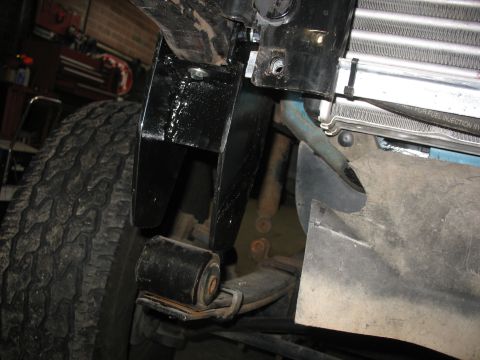 1995 Ford C-350 (Centurion Conversions) - Undercarriage view shows suspension components, including a leaf spring and bushing.