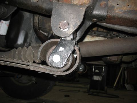 1995 Ford C-350 (Centurion Conversions) - Underside view of a vehicle's suspension system, focusing on a roller mechanism.