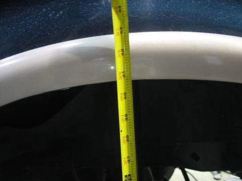 1995 Ford C-350 (Centurion Conversions) - A measuring tape is used to show the clearance in the wheel well, indicating 41 inches.