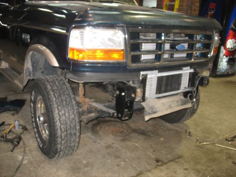 1995 Ford C-350 (Centurion Conversions) - Front view of a 1995 Ford C-350 (Centurion Conversions) with the bumper removed, revealing the radiator.