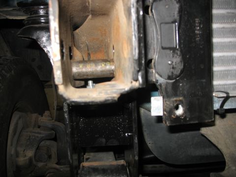 1995 Ford C-350 (Centurion Conversions) - A detailed view of a suspension component, likely part of a truck's front end.