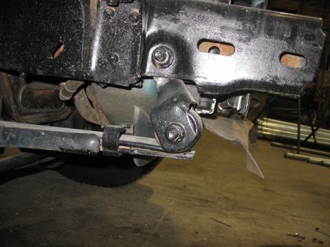 1995 Ford C-350 (Centurion Conversions) - Detail of truck frame and suspension components, likely during maintenance or modification.