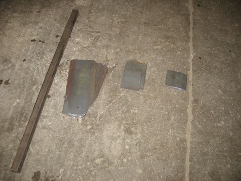 1995 Ford C-350 (Centurion Conversions) - Metal fabrication parts laid out on a concrete surface.
