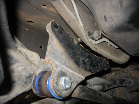 1995 Ford C-350 (Centurion Conversions) - Underside view of a vehicle's suspension system, focusing on a specific part.