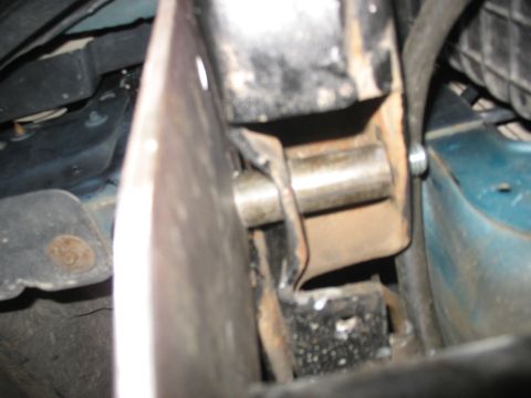 1995 Ford C-350 (Centurion Conversions) - A detailed view of a vehicle's suspension system, focusing on a specific mechanical part.