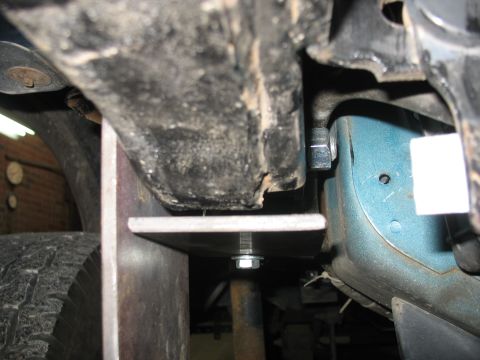 1995 Ford C-350 (Centurion Conversions) - Custom bracket installed on the undercarriage of a vehicle, likely for suspension modification.