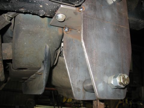 1995 Ford C-350 (Centurion Conversions) - Custom fabricated bracket attached to the vehicle's frame, showing heavy-duty hardware and welding.