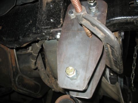 1995 Ford C-350 (Centurion Conversions) - Custom suspension modification, likely for off-road use, a fabricated bracket and hardware.