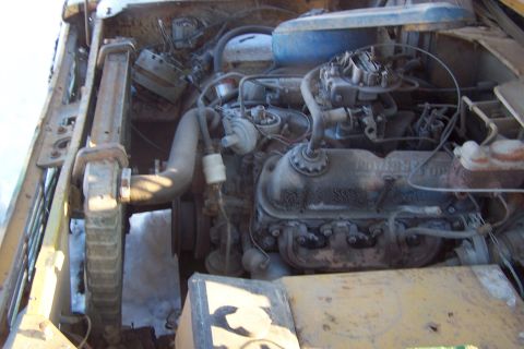 1987 Ford Bronco II — Engine bay with V8 engine, carburetor, radiator, and hoses.