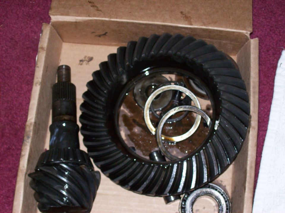New differential ring and pinion gear set with bearings and shims in a cardboard box