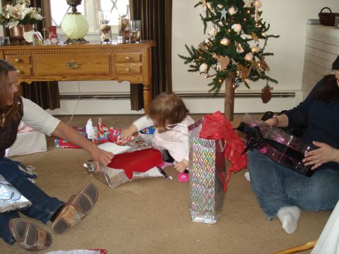 2000 Ford Crown Victoria - Family celebrates Christmas morning, opening presents around the tree.