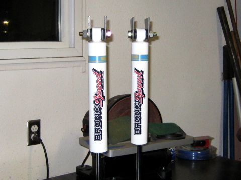 1996 Ford Bronco - Two shock absorbers are shown, likely for a vehicle's front suspension.