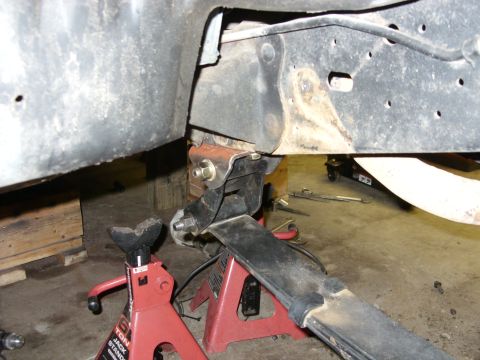 1988 Ford Bronco - Vehicle suspension components are elevated on jack stands for maintenance or repair.