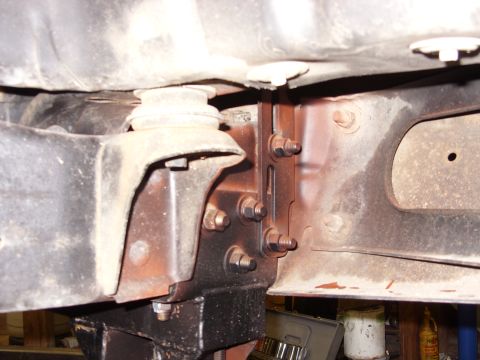 1988 Ford Bronco - This image shows a close-up view of the vehicle's frame and suspension mounting hardware.
