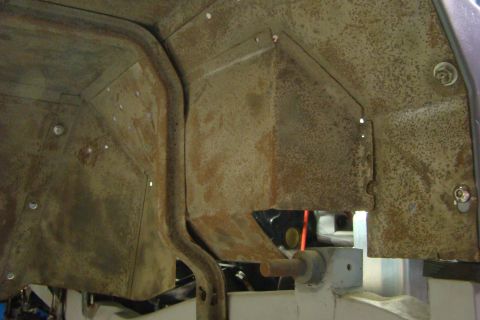1948 Jeep Wrangler - Interior view of a heavily rusted vehicle wheel well, showing structural metalwork.
