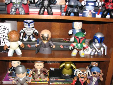 1991 Ford Bronco - Several shelves filled with various Star Wars character figures, including Boba Fett and Jango Fett.