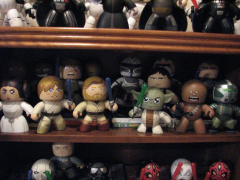 1991 Ford Bronco - A collection of Star Wars character figures are displayed on wooden shelves.