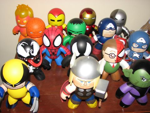 1991 Ford Bronco - A group of stylized Marvel character toys are displayed together on a surface.