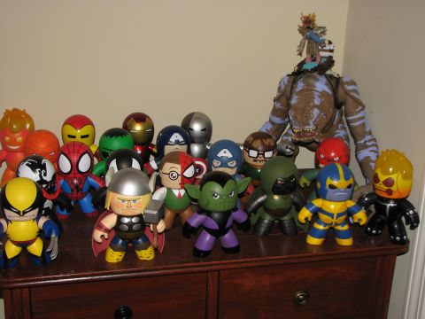 1991 Ford Bronco - A variety of Marvel character toys are displayed on a dresser, with a large monster figure in the background.