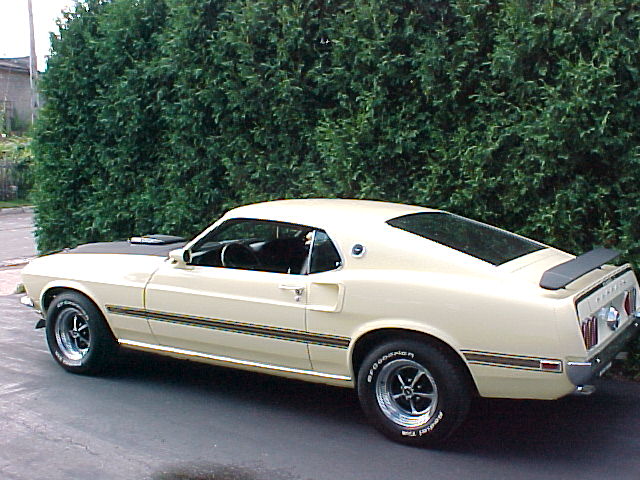 1969 Ford Mustang Mach 1, cream exterior, black hood scoop and spoiler