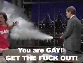 1995 Ford Bronco - A man in a red shirt sprays smoke while another man in a suit looks on.