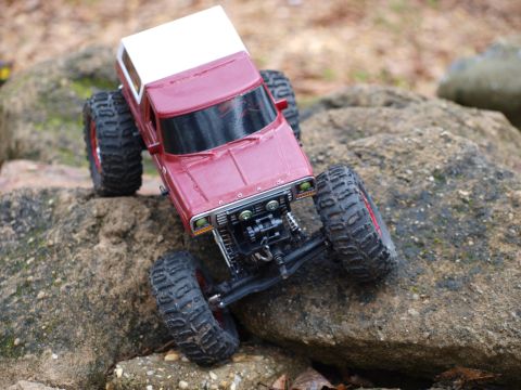 1978 Ford Bronco - A miniature off-road vehicle navigates a rocky terrain.