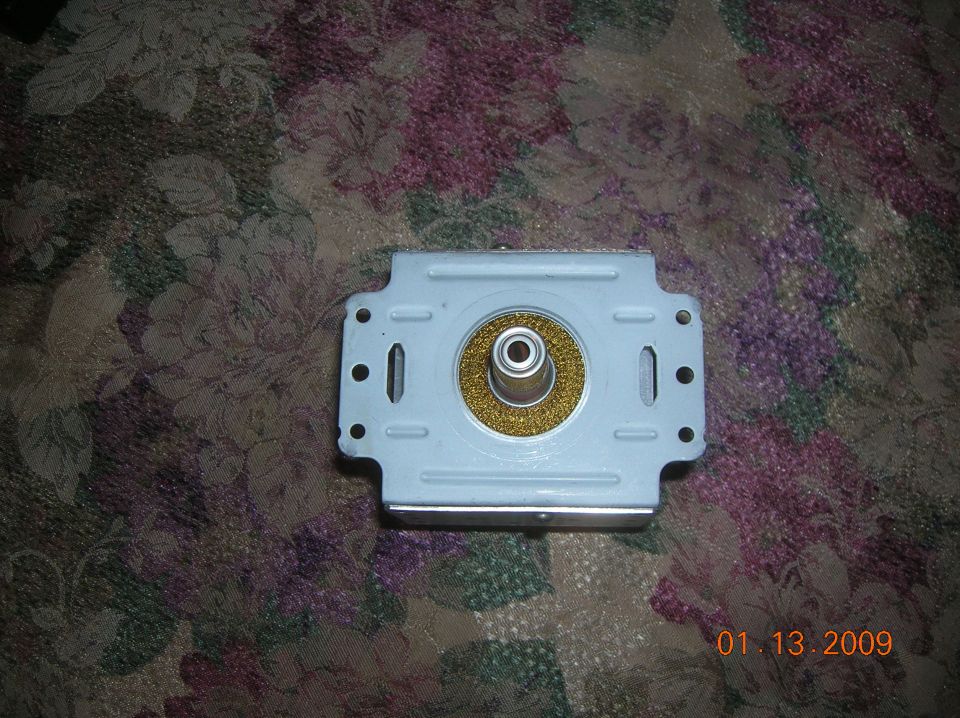 Metal part with circular grate and mounting holes, dated 01.13.2009