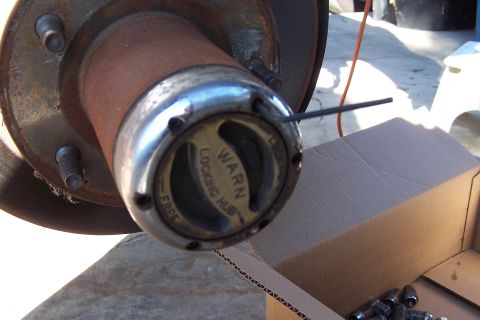 1990 Ford Bronco - A Warn locking hub is shown, with text indicating 'FREE' and 'LOCKING HUB' settings.
