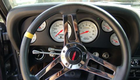 1970 Ford Mustang - Interior view of a 1970 Ford Mustang with a Grant steering wheel and custom gauges.